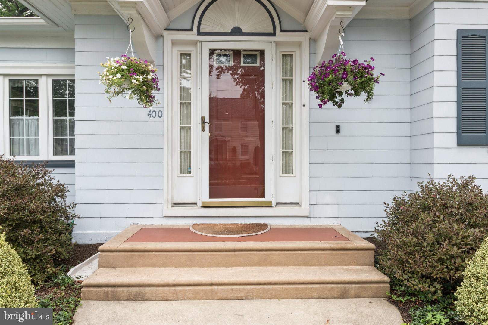 400 Maple Avenue Haddonfield, NJ 08033 - Photo 2 of 31 a front view of a house with a garden