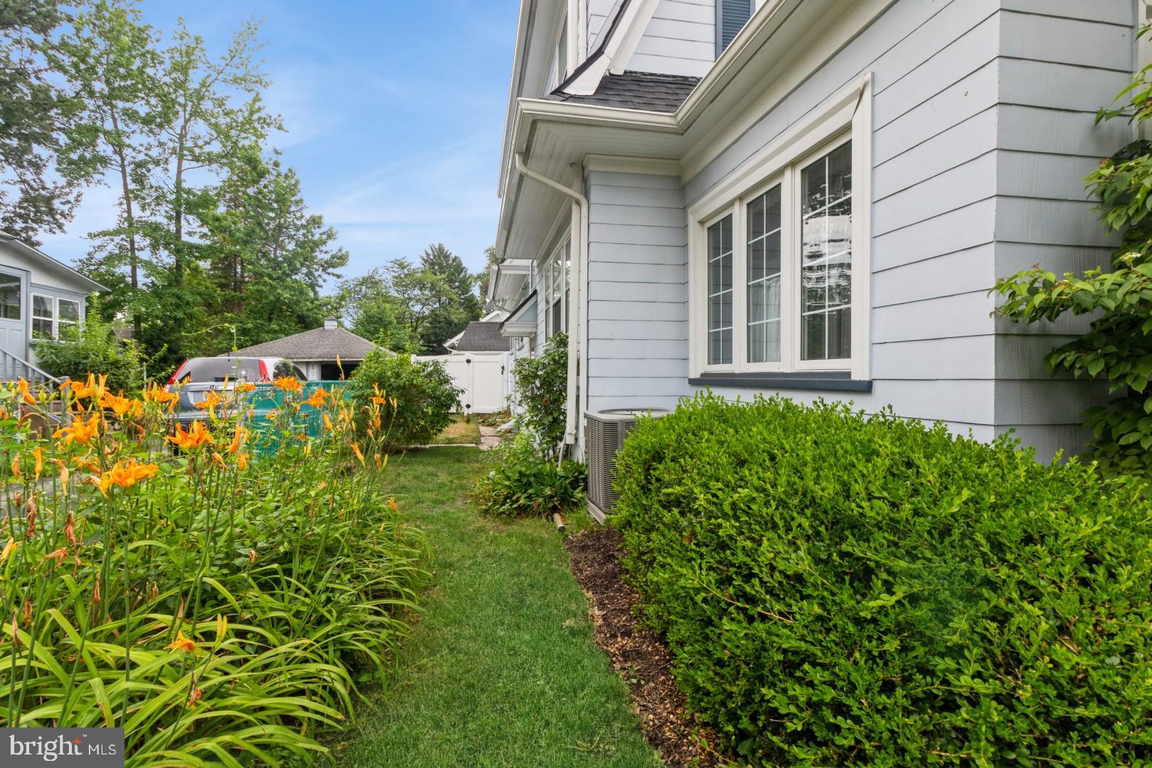 400 Maple Avenue Haddonfield, NJ 08033 - Photo 30 of 31 a view of a house with a small yard and plants