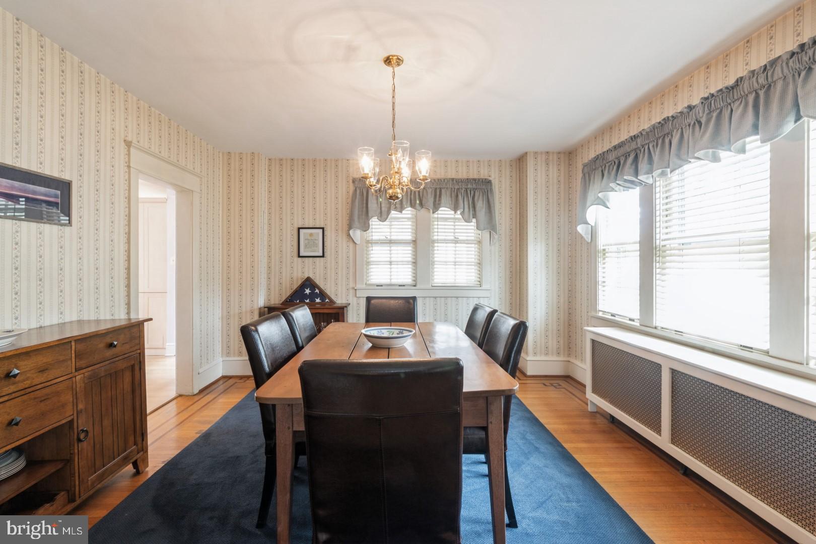 400 Maple Avenue Haddonfield, NJ 08033 - Photo 10 of 31 a dining room with furniture a chandelier and wooden floor