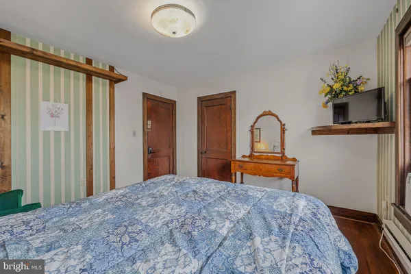 a dining room with a table and chairs