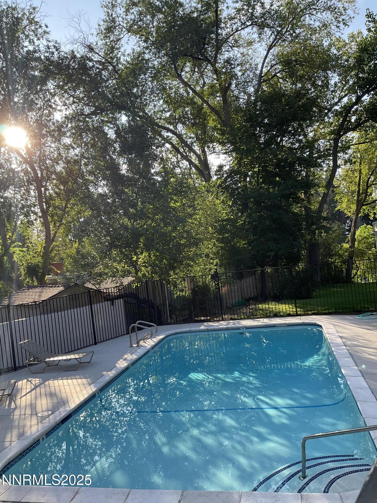 2300 Dickerson Road, Unit 8 Reno, NV 89503 - Photo 14 of 18 a view of a backyard with tree s