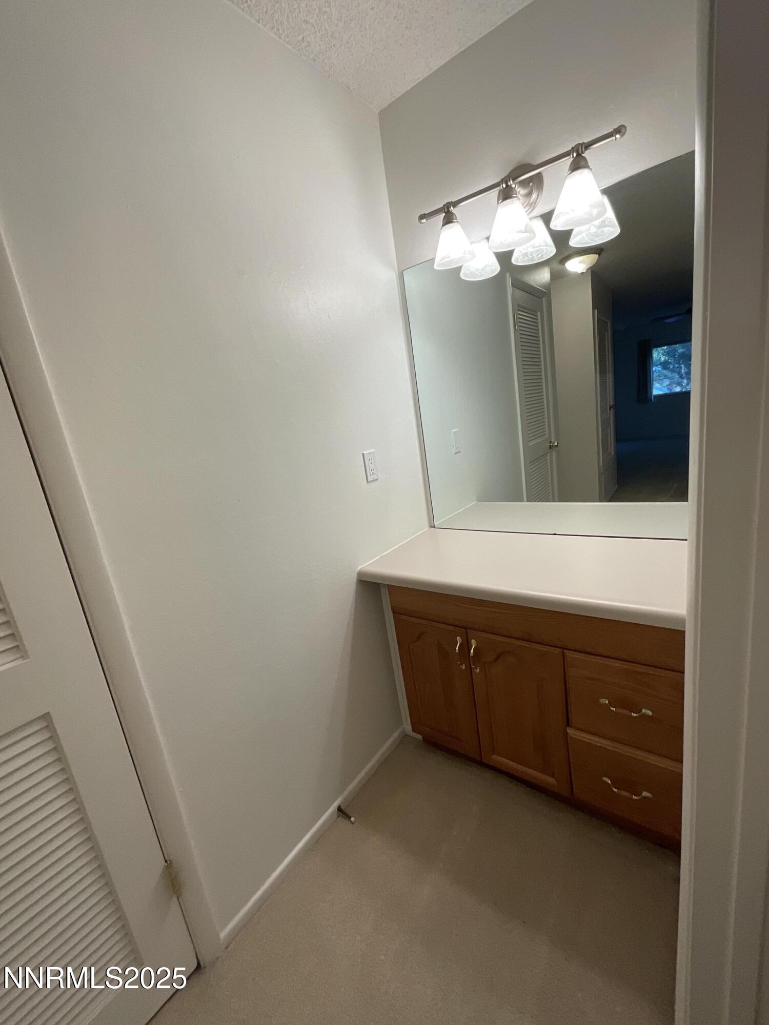 2300 Dickerson Road, Unit 8 Reno, NV 89503 - Photo 8 of 18 a bathroom with a sink and a mirror