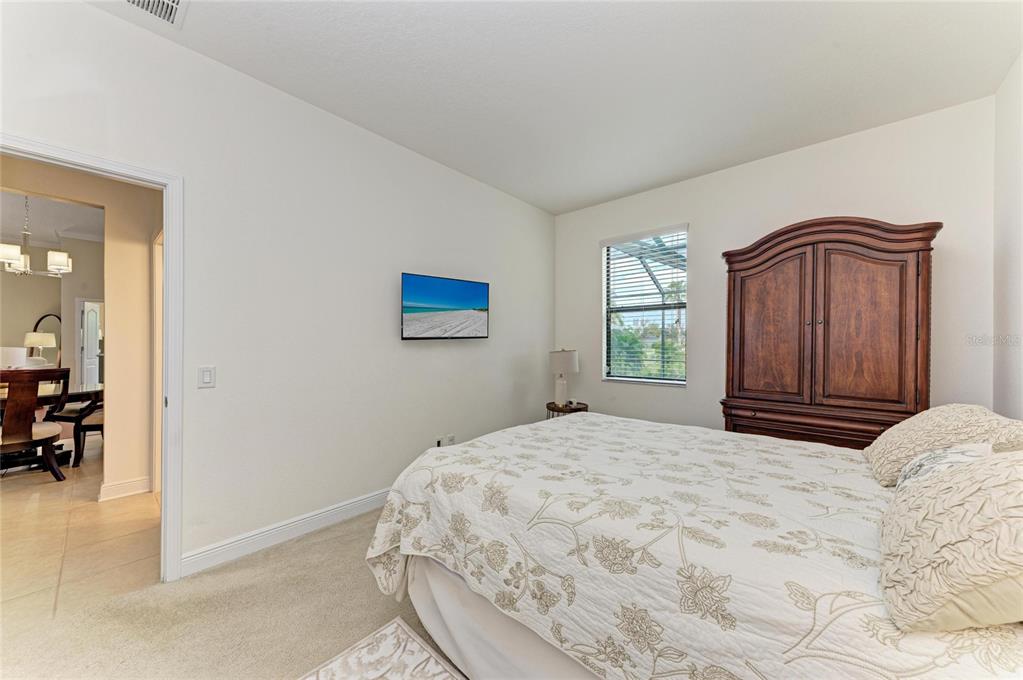 302 Cockle Shell Loop Apollo Beach, FL 33572 - Photo 42 of 75 a bedroom with a bed and a dresser