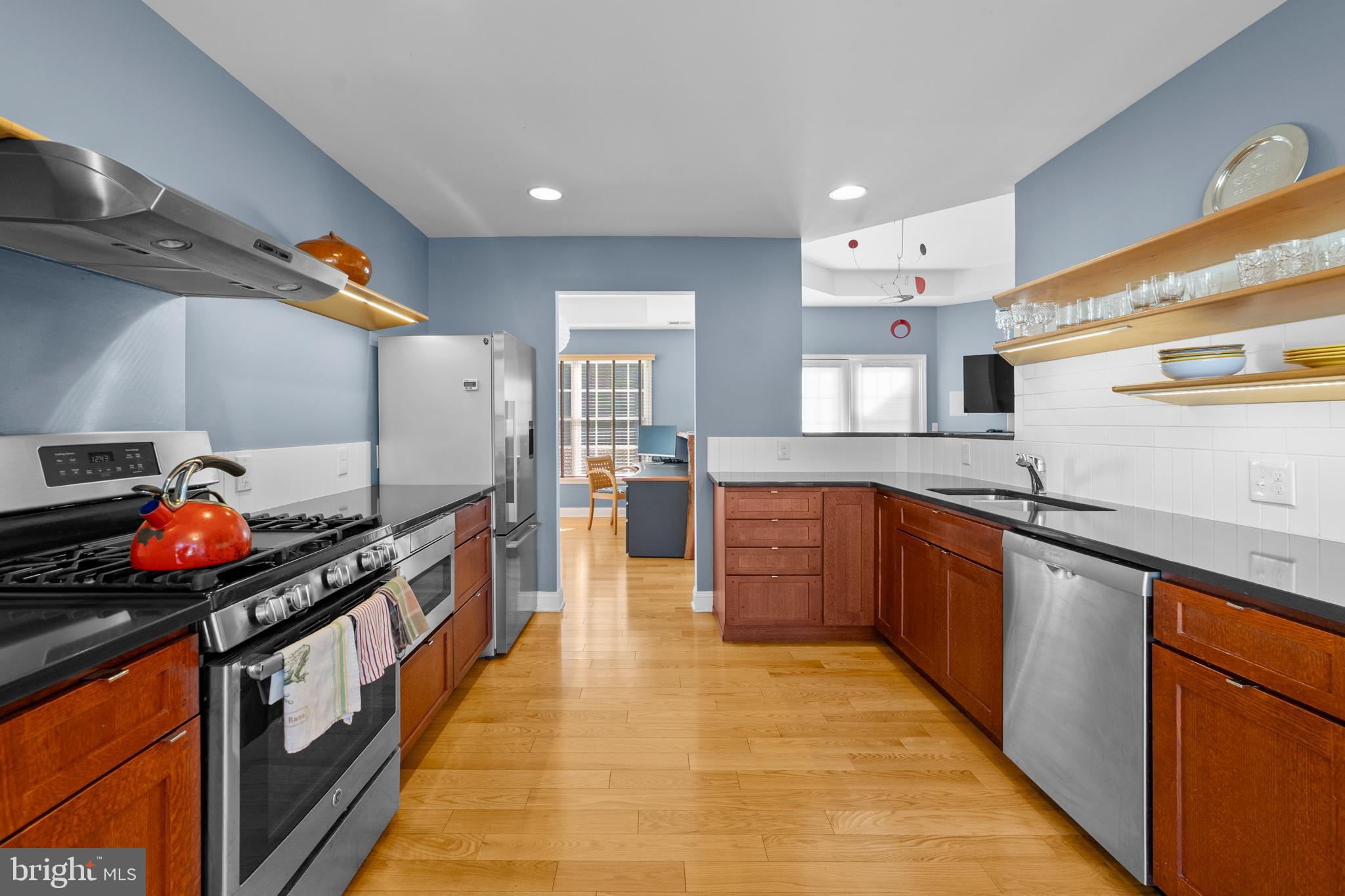 47 Hedge Row Road Princeton, NJ 08540 - Photo 3 of 21 a kitchen with stainless steel appliances granite countertop a stove and a sink
