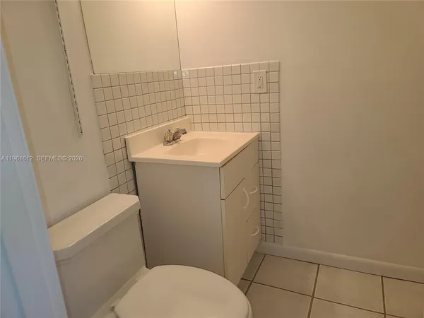 a bathroom with a sink and toilet