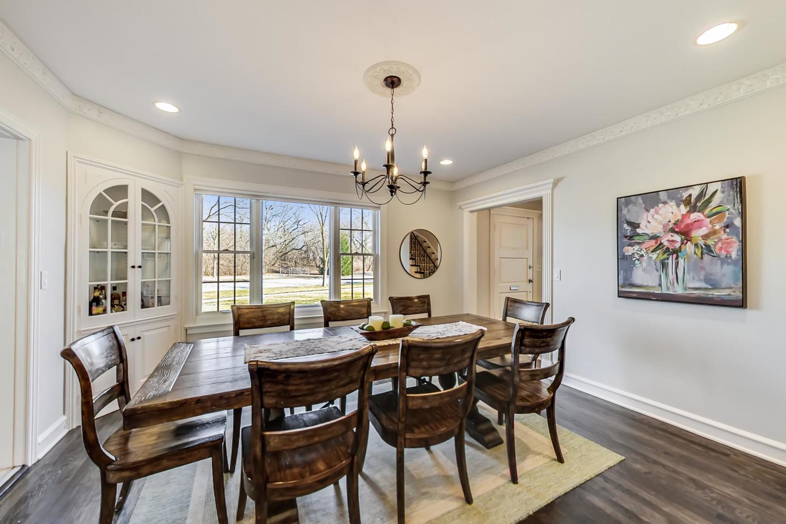 206 Green Bay Road Winnetka, IL 60093 - Photo 7 of 45 a view of a dining room with furniture wooden floor and chandelier