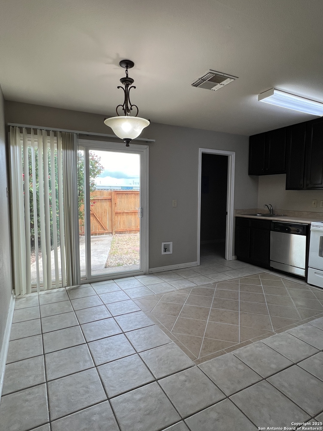 9140 Timber Path, Unit 802 San Antonio, TX 78250 - Photo 12 of 29 a view of an empty room with a window