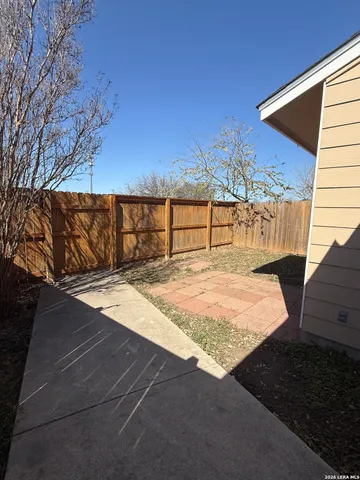 a view of swimming pool with a patio
