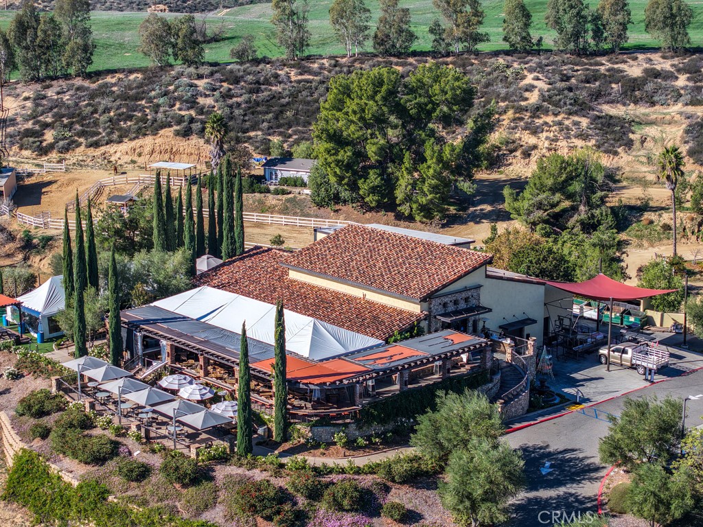 0 Reid Court Temecula, CA 92591 - Photo 28 of 31 a view of a patio with table and chairs under an umbrella