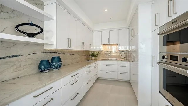 a kitchen with a sink and cabinets