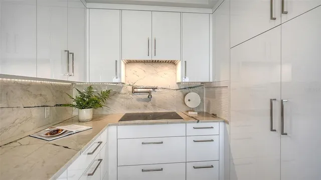 a bedroom with a bed and glass wall