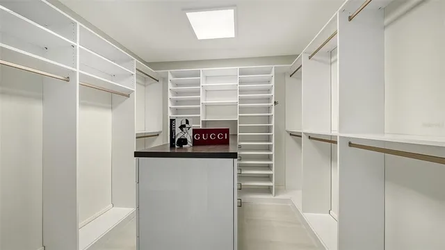 a living room with furniture fireplace and potted plants