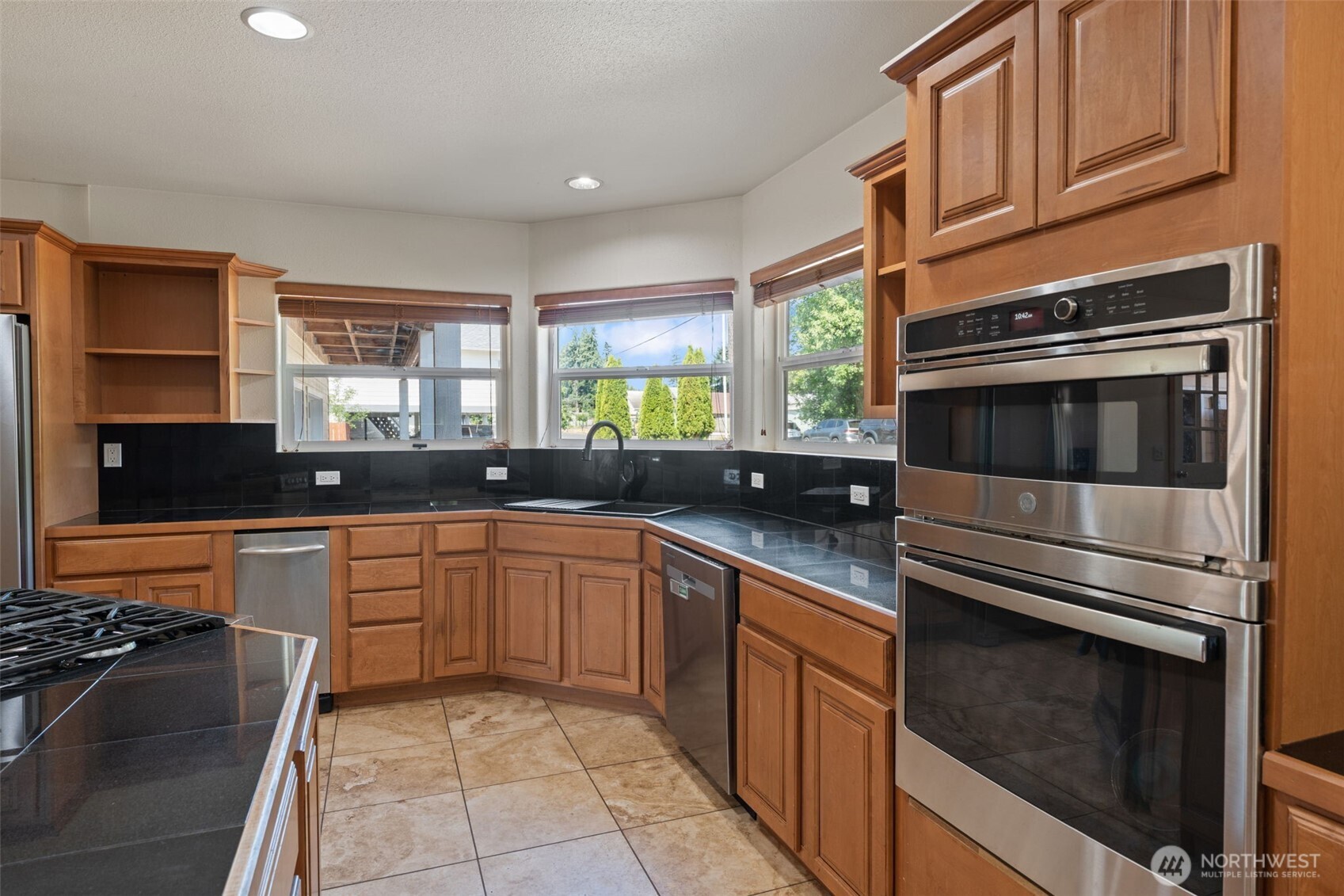 802 State Street Centralia, WA 98531 - Photo 12 of 40 a kitchen with stainless steel appliances granite countertop a stove and a sink