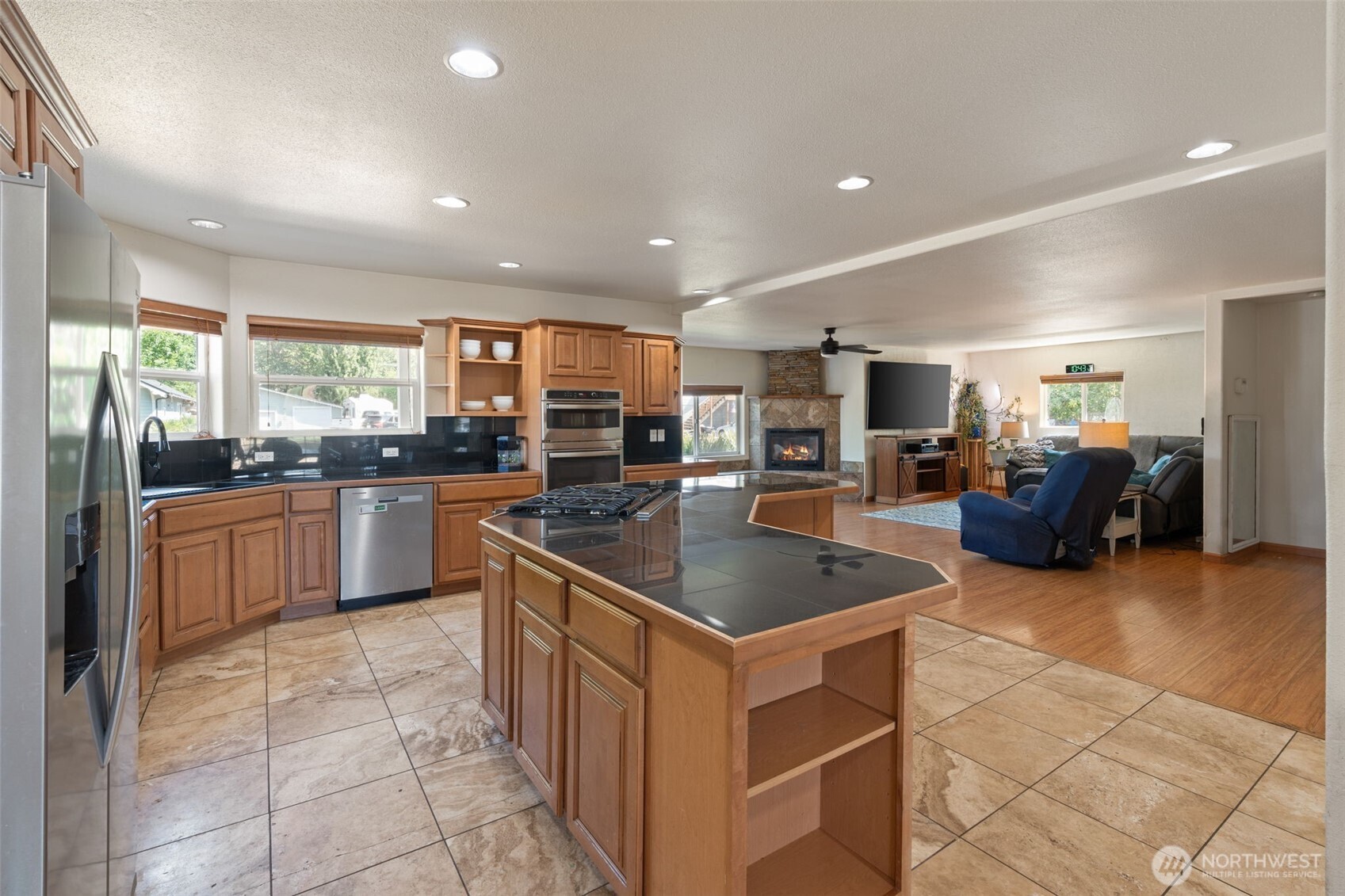 802 State Street Centralia, WA 98531 - Photo 13 of 40 a kitchen with stainless steel appliances a sink a counter top space a stove a refrigerator cabinets and a window