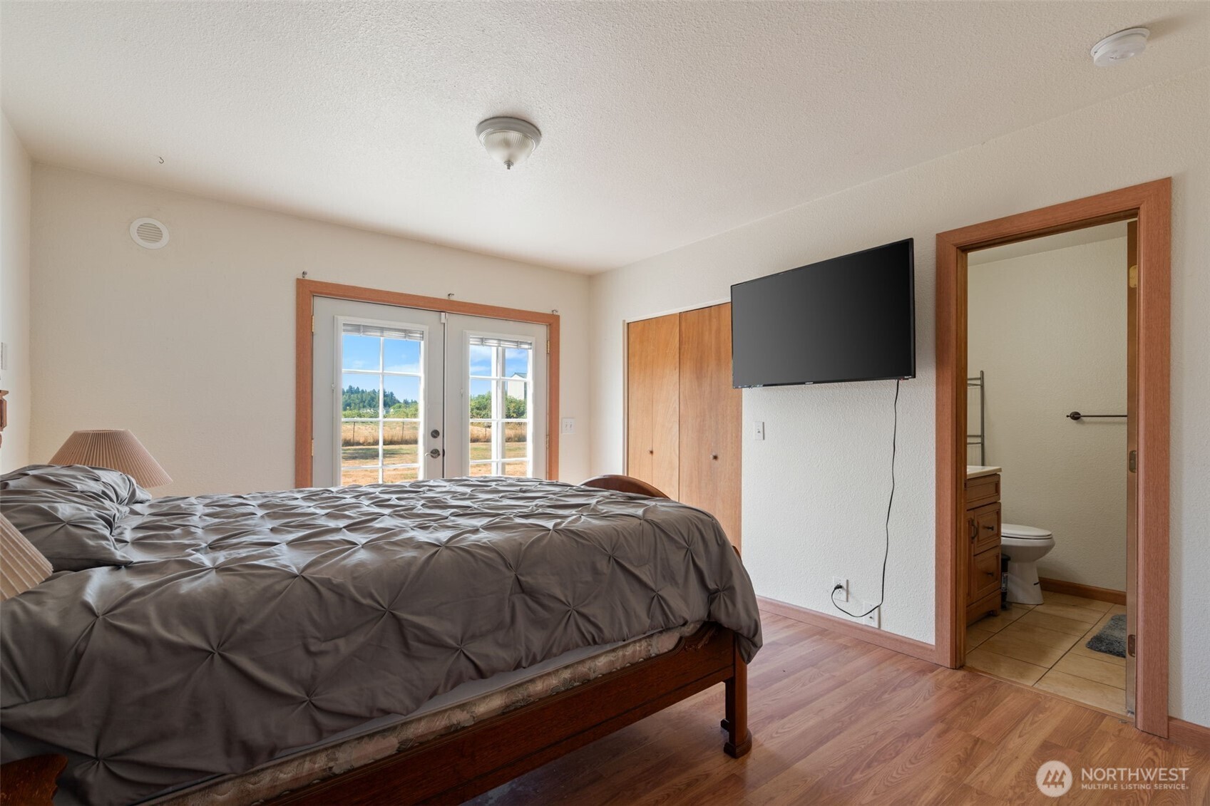 802 State Street Centralia, WA 98531 - Photo 17 of 40 a bedroom with a bed and a flat screen tv