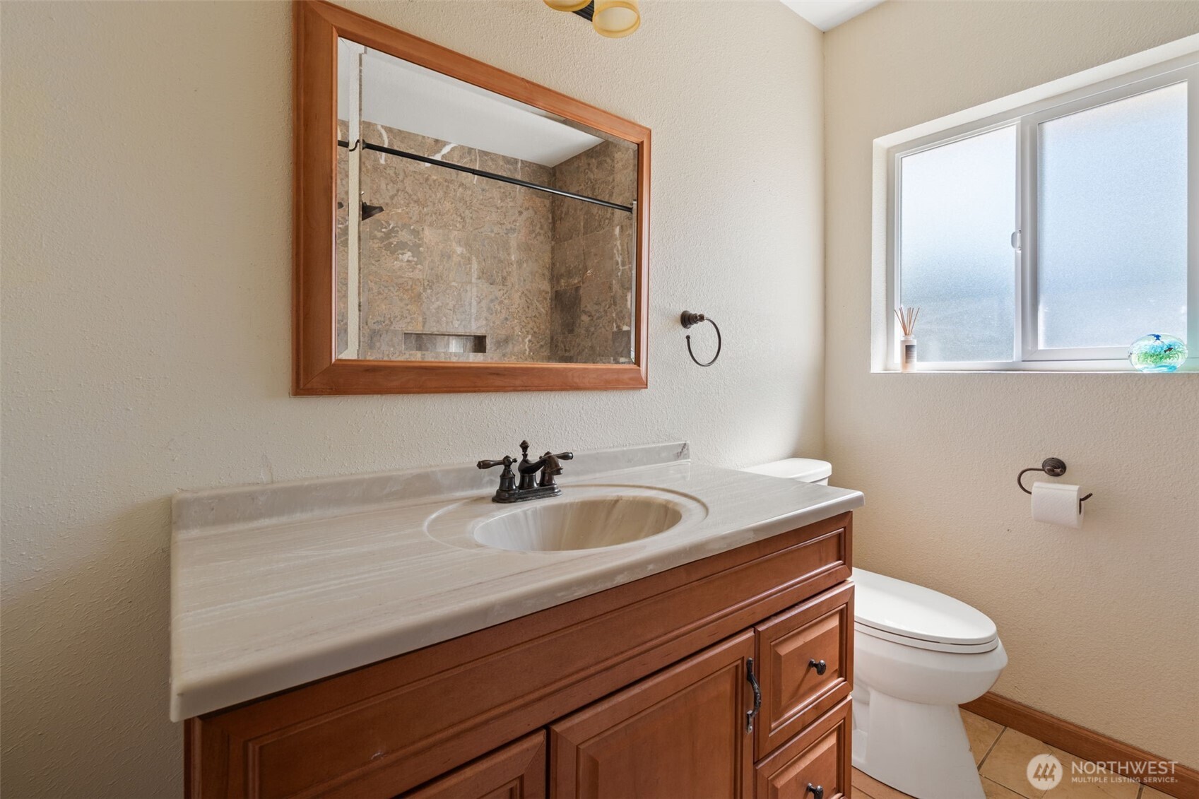 802 State Street Centralia, WA 98531 - Photo 20 of 40 a bathroom with a sink a toilet and mirror