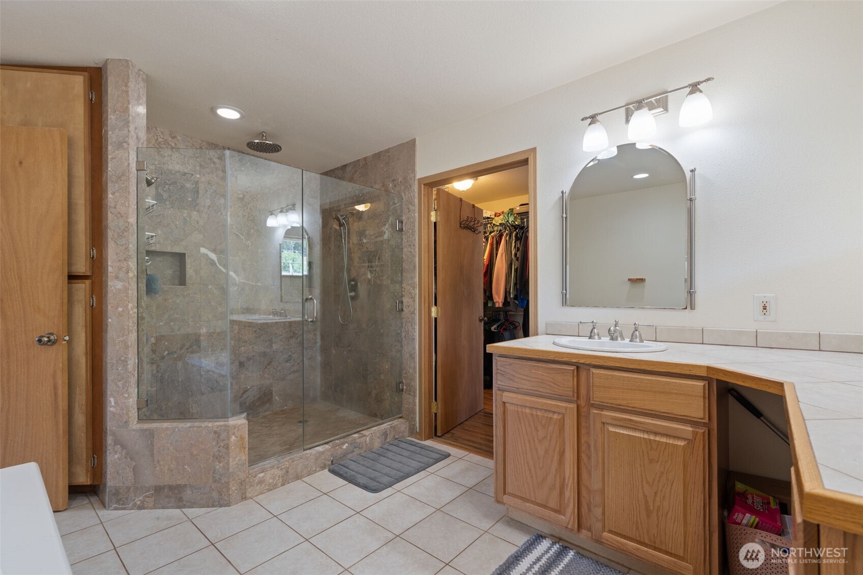 802 State Street Centralia, WA 98531 - Photo 27 of 40 a spacious bathroom with a shower sink mirror and