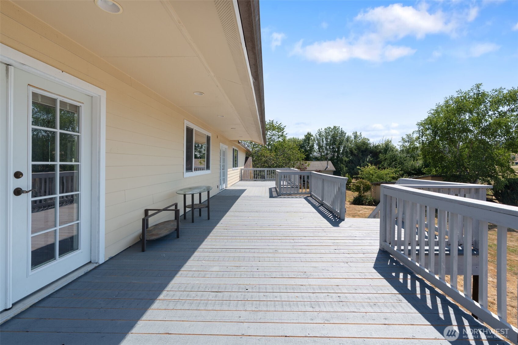 802 State Street Centralia, WA 98531 - Photo 31 of 40 a view of roof deck with wooden floor and fence