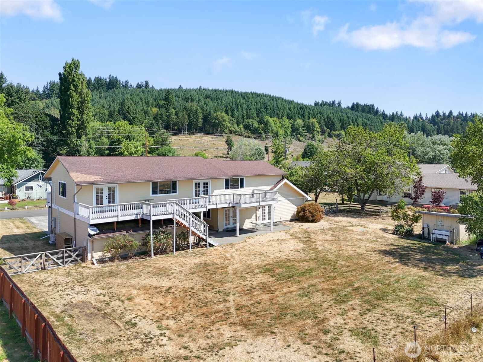 802 State Street Centralia, WA 98531 - Photo 34 of 40 a view of a house with a wooden deck and a big yard
