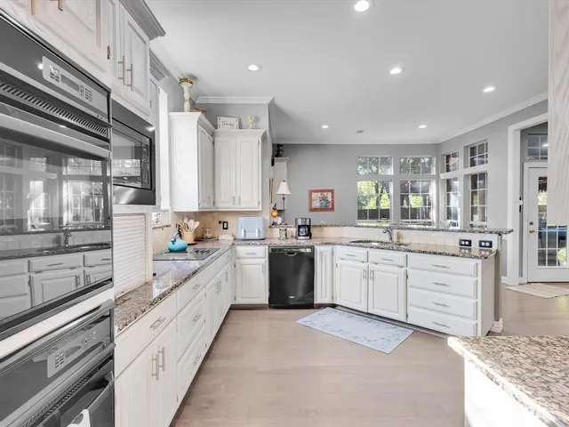 a large kitchen with a large window