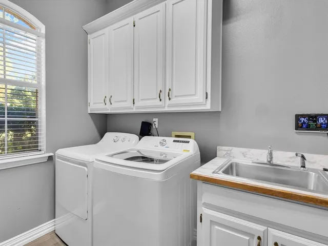 a kitchen with stainless steel appliances granite countertop a refrigerator and a stove