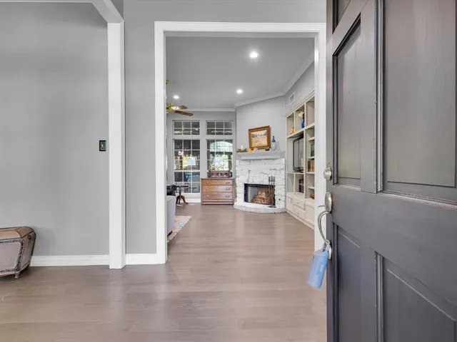 a view of living room with furniture and a fireplace