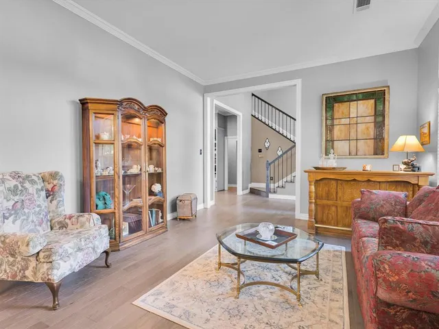 a living room with furniture and a table