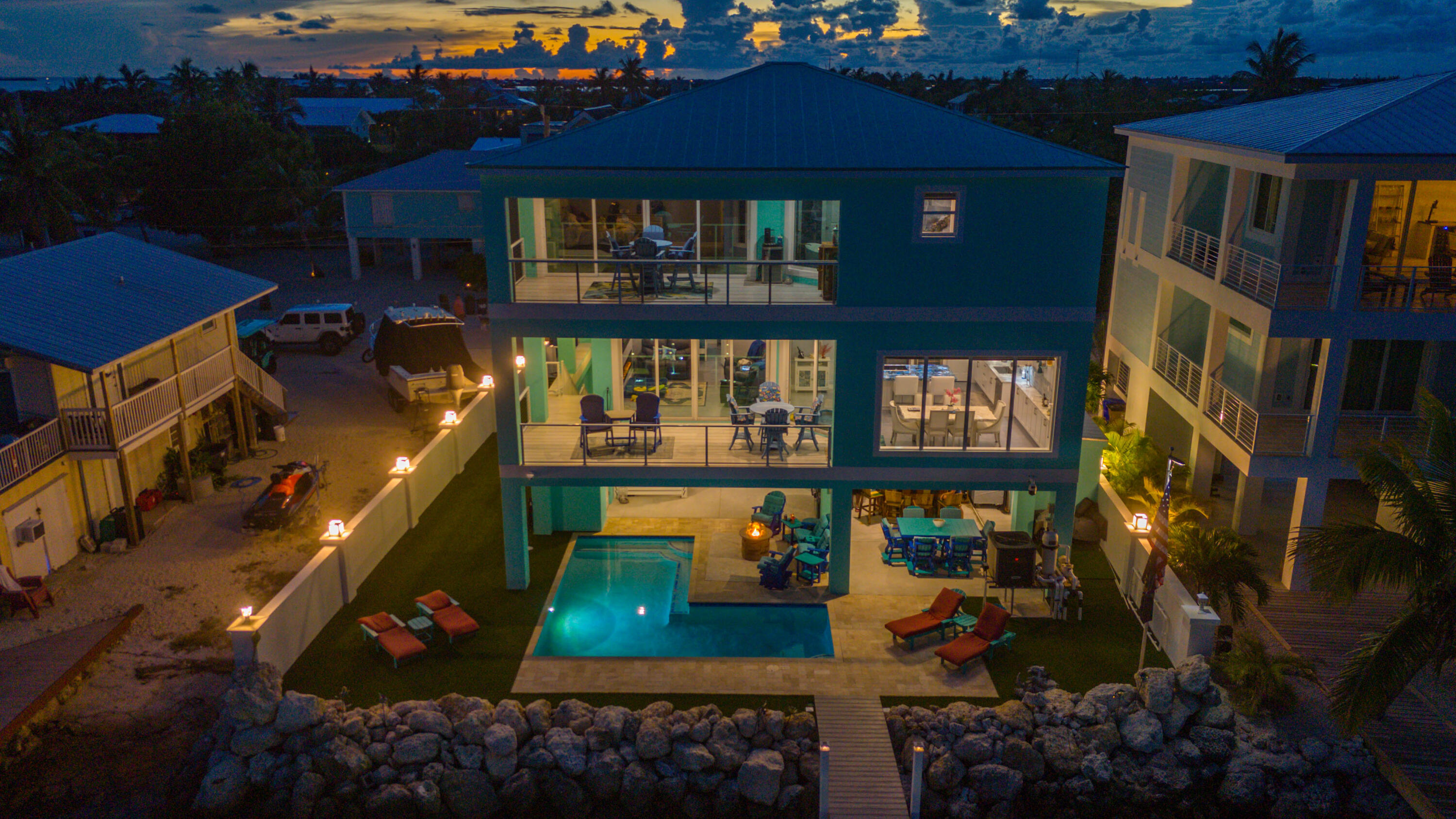 747 La Fitte Road Summerland Key, FL 33042 - Photo 16 of 103 a view of a balcony with chairs and a potted plant