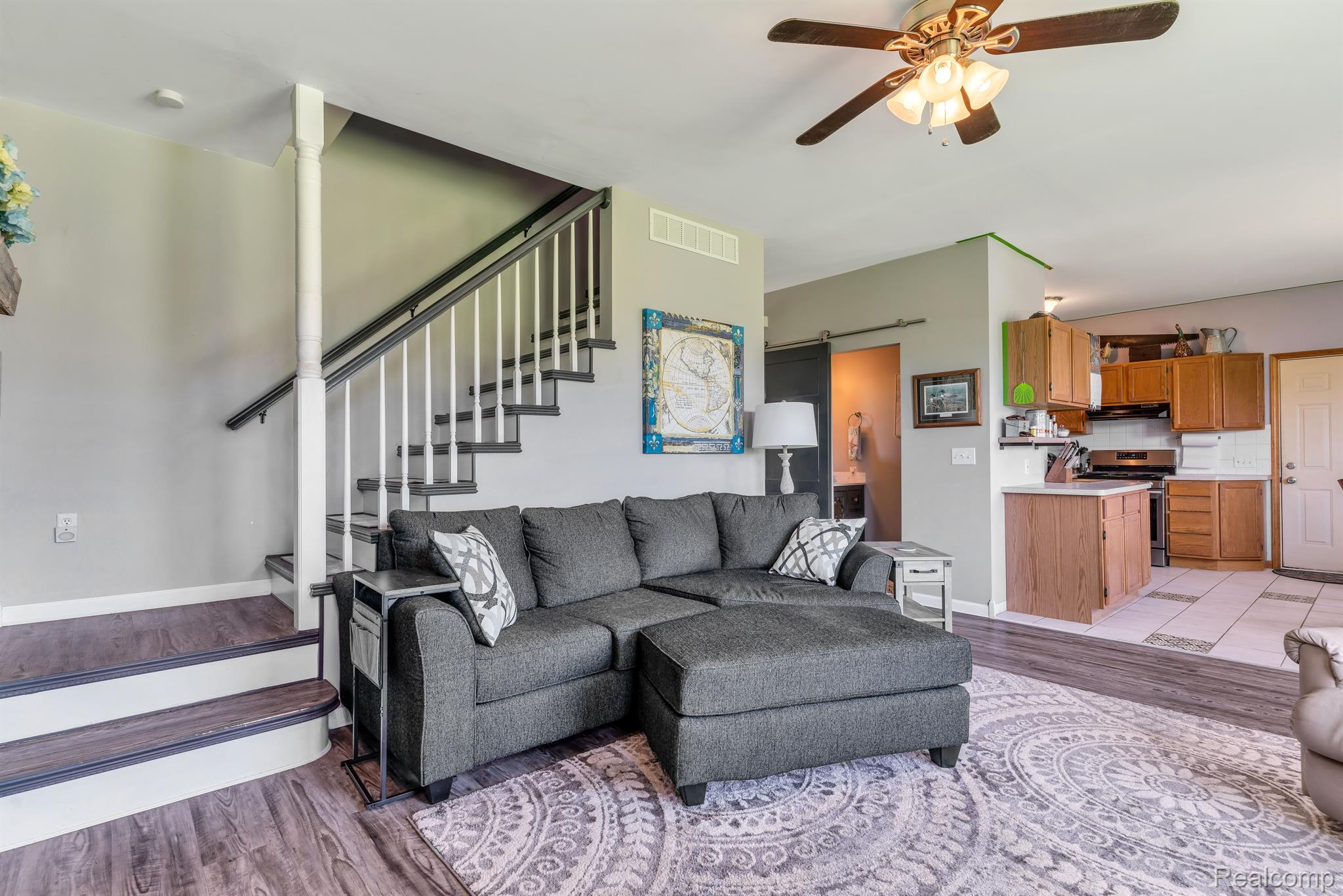 5389 Bentley Lake Road Howell, MI 48843 - Photo 13 of 48 The living room flows into the dining nook/kitchen