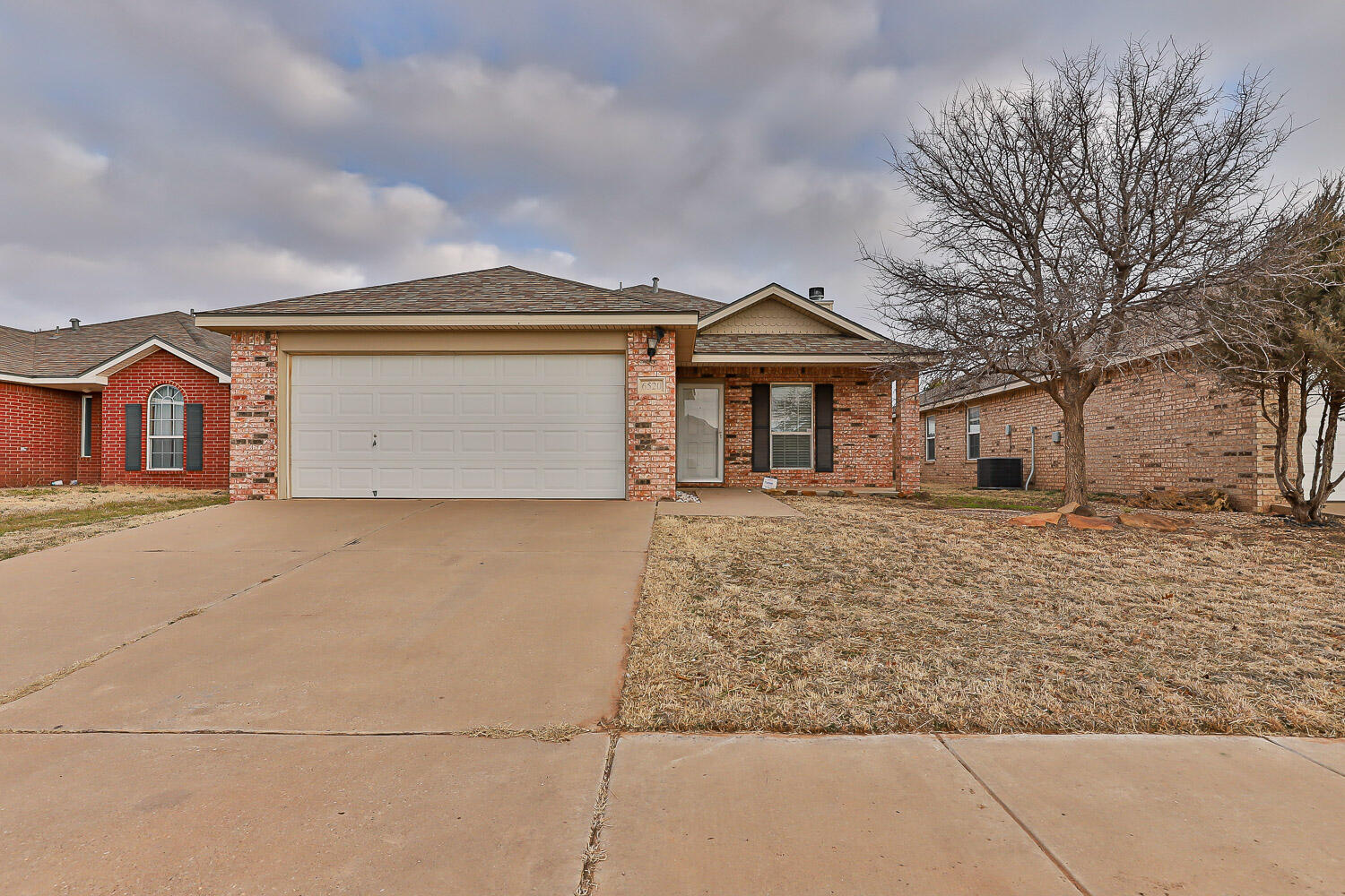 front view of a house with a dry yard