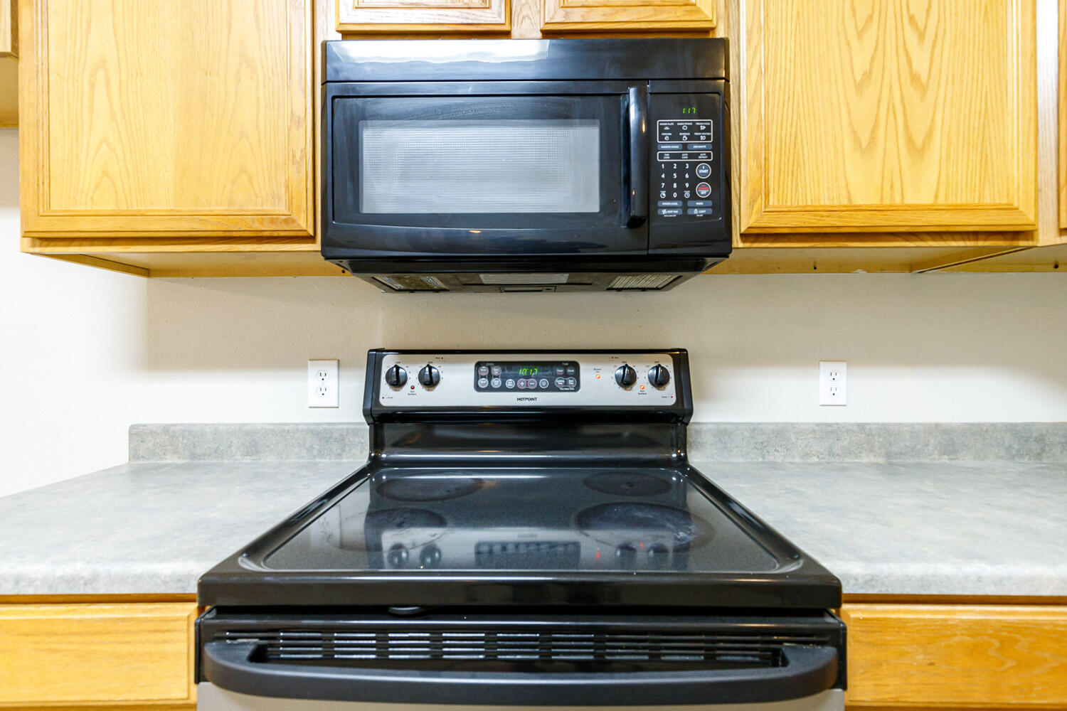 6520 92nd Street Lubbock, TX 79424 - Photo 14 of 30 a stove top oven sitting inside of a kitchen