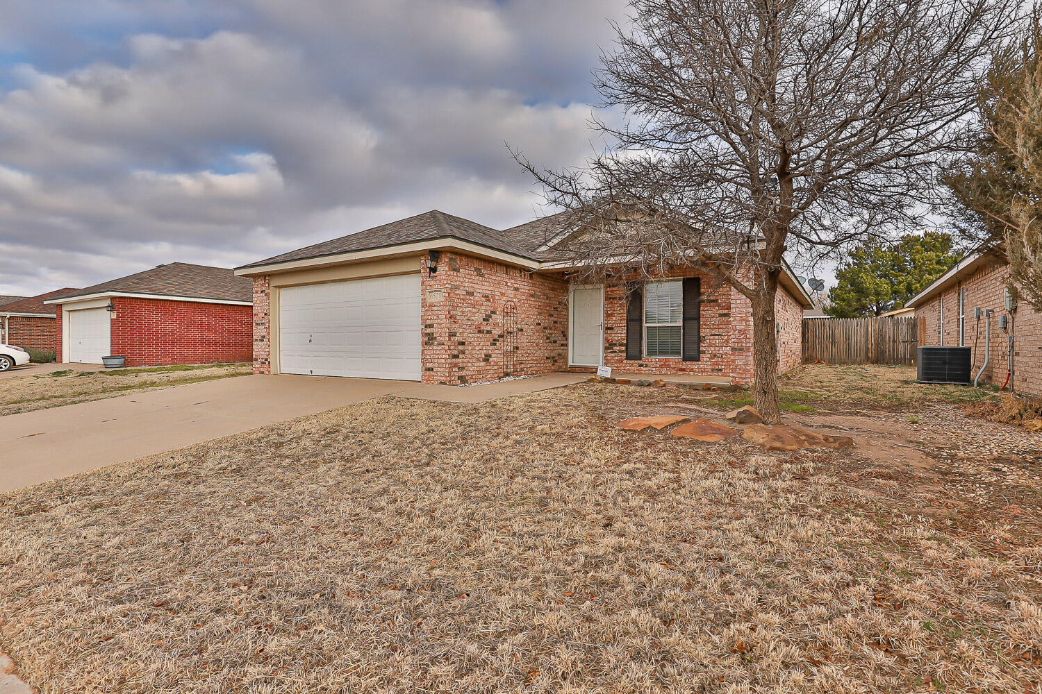 6520 92nd Street Lubbock, TX 79424 - Photo 2 of 30 front view of a house with a dry yard