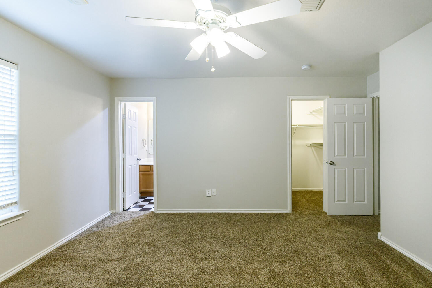 6520 92nd Street Lubbock, TX 79424 - Photo 21 of 30 a view of an empty room and chandelier fan