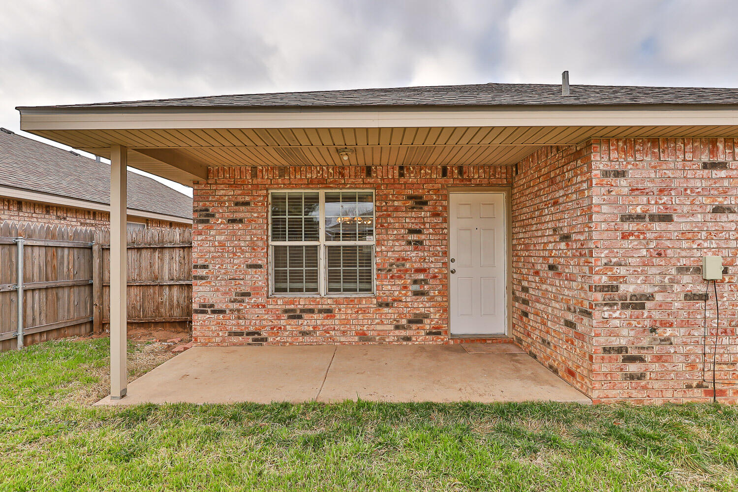 6520 92nd Street Lubbock, TX 79424 - Photo 5 of 30 a front view of a house with a yard