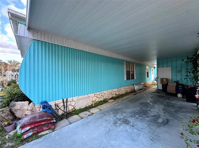 a view of a backyard with table and chairs