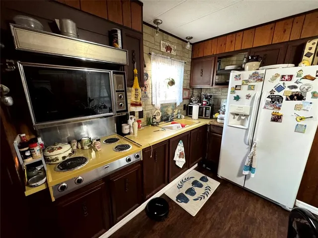 a utility room with sink dryer and washer
