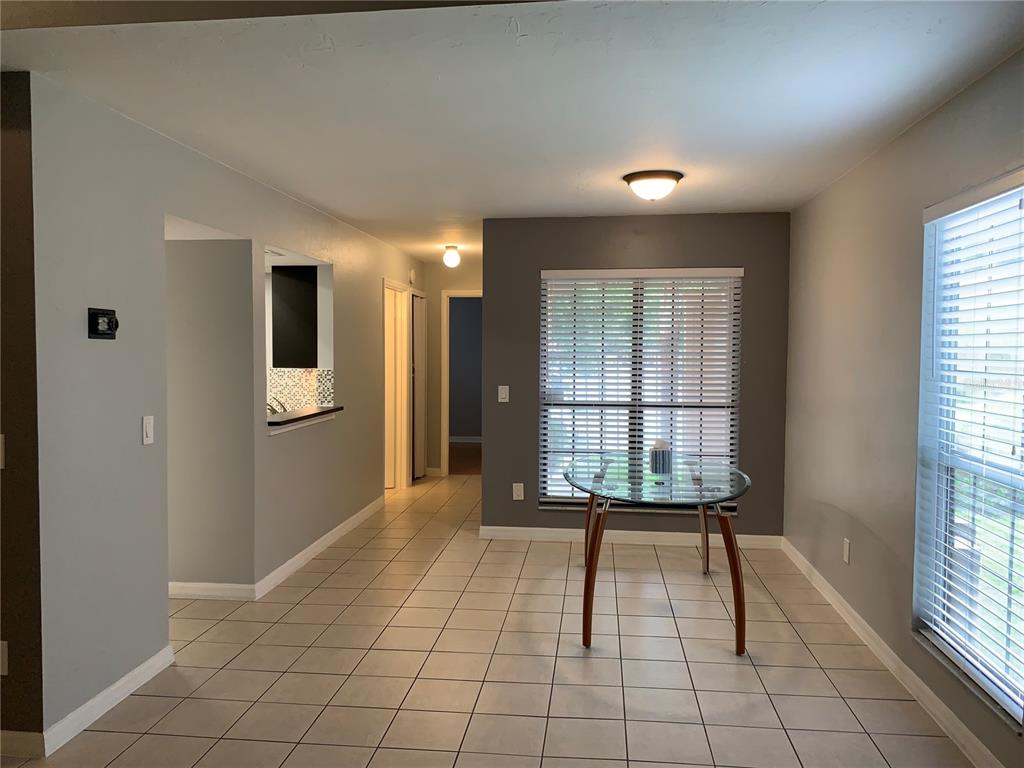5754 Southwest 8th Place Gainesville, FL 32607 - Photo 8 of 29 a view of an entryway with wooden floor and a window