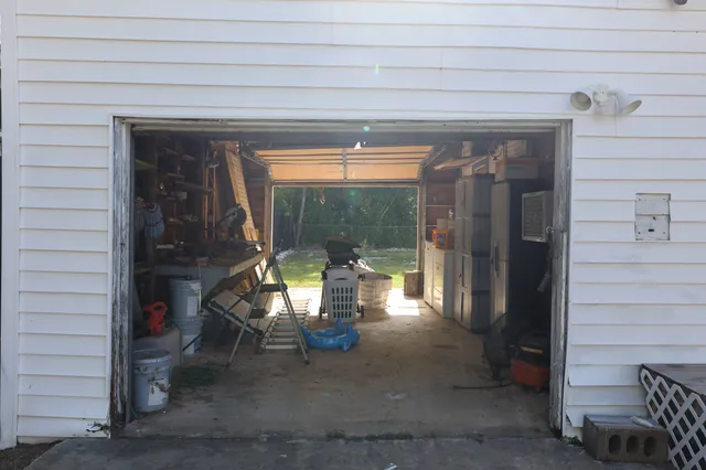 a view of a room with wooden floor and a window