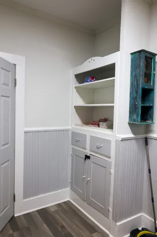 a kitchen with refrigerator and window