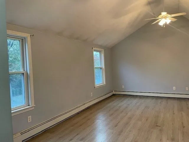 a view of room with window and hardwood floor