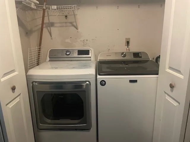a view of hallway with wooden floor