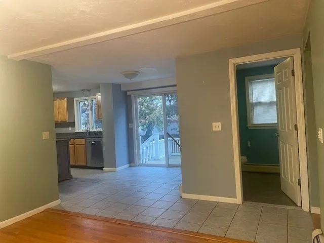 a view of a backyard with large trees