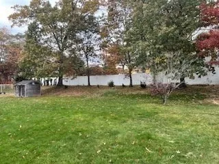 an empty room with closet and wooden door