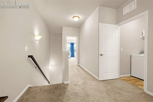 a spacious bedroom with a bed and window