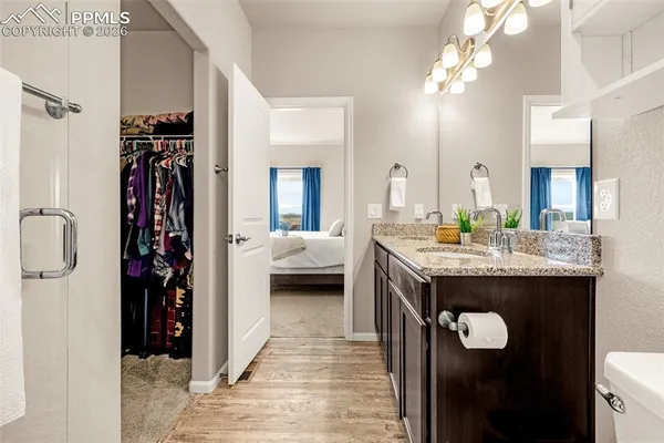 a bedroom with a bed and a cabinets