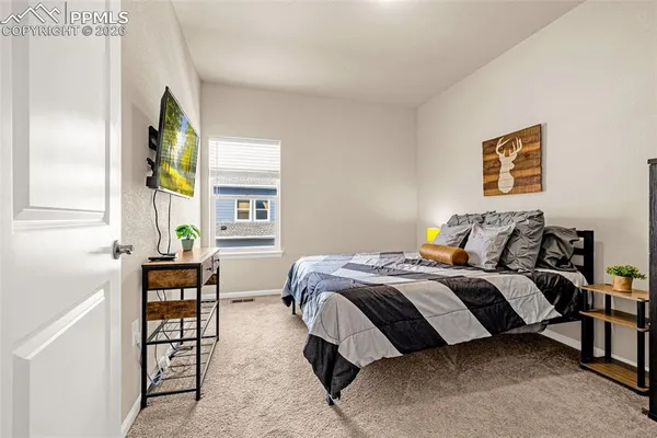 a bathroom with a granite countertop sink toilet a mirror and shower