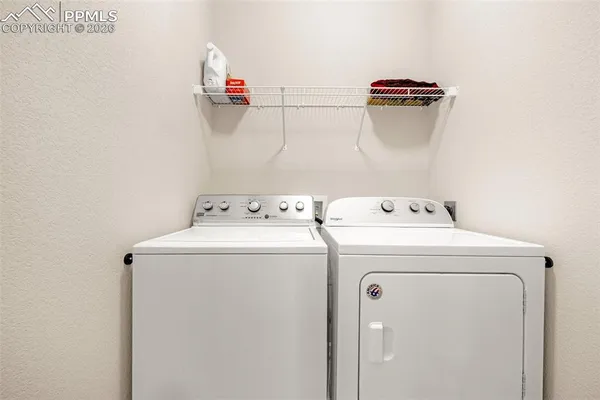 a view of a house with a parking space