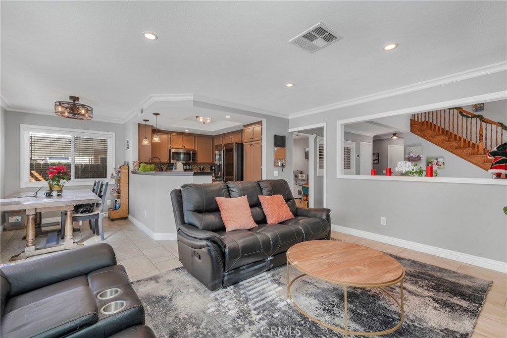3670 Windstorm Way Riverside, CA 92503 - Photo 11 of 43 a living room with furniture and a flat screen tv