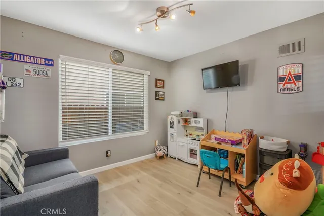 a bedroom with furniture and a window