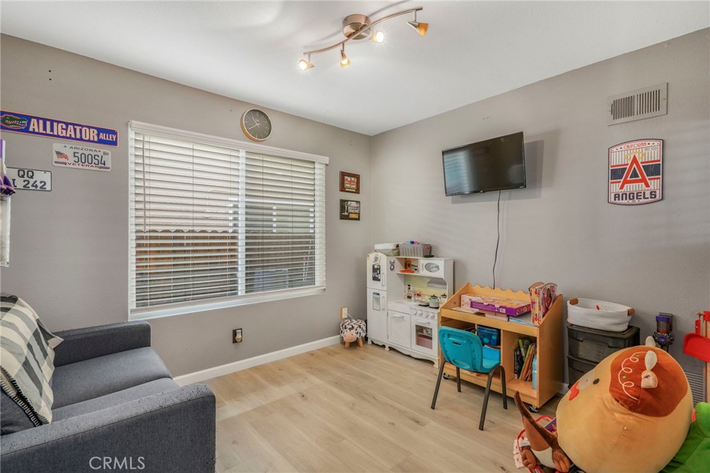 3670 Windstorm Way Riverside, CA 92503 - Photo 12 of 43 a bedroom with furniture and a window